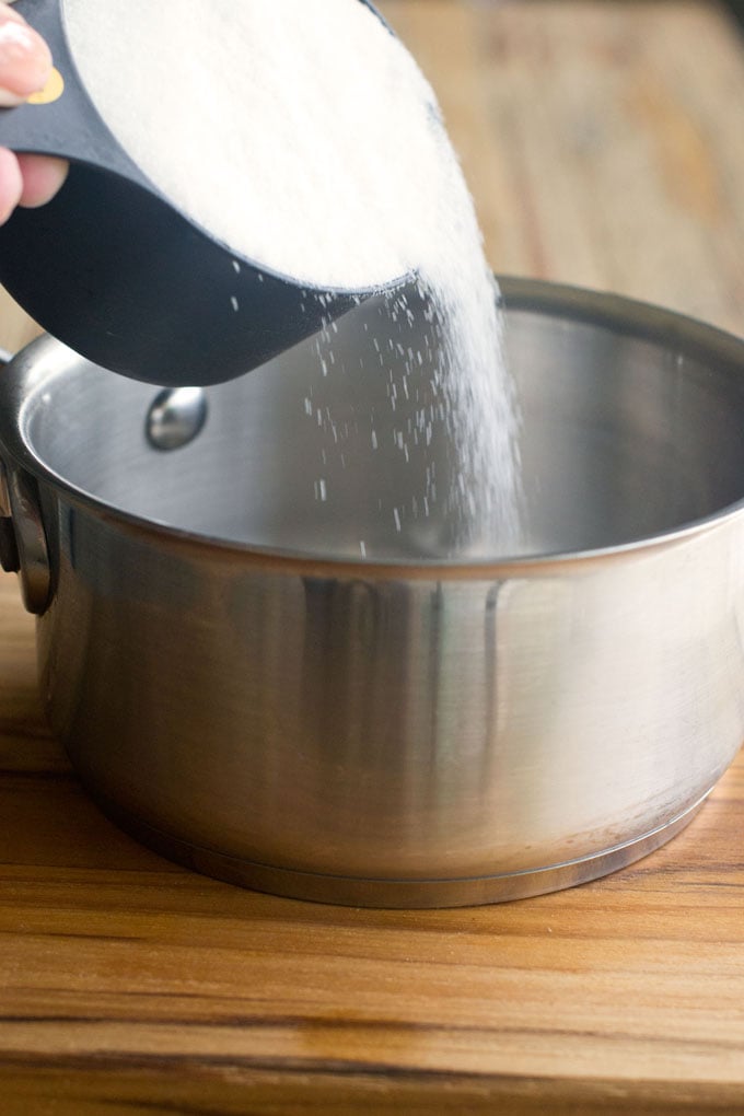 Measure 1 cup of sugar into a small saucepan.