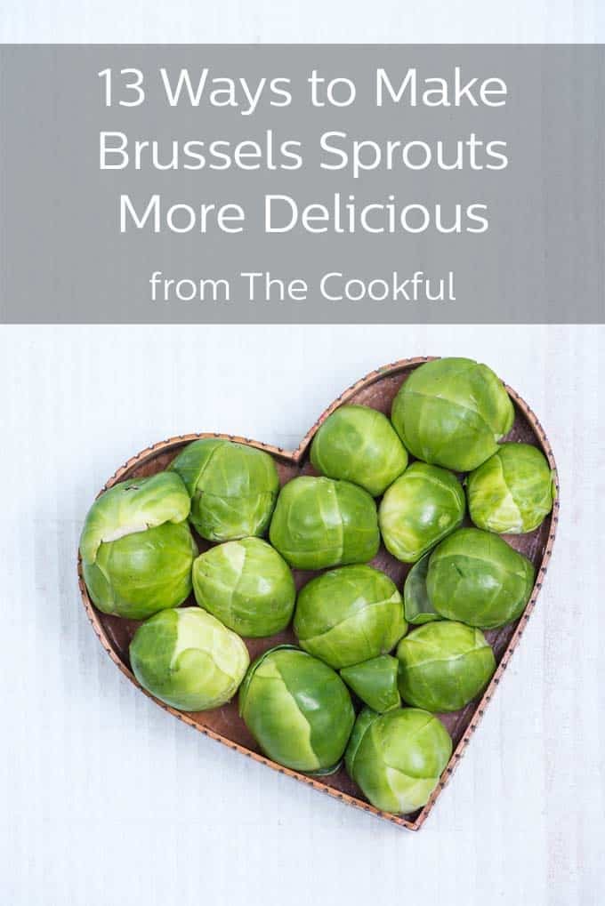 Whole, raw brussels sprouts in a heart shaped tray. The banner across the top reads, "13 Ways to Make Brussels Sprouts More Delicious from The Cookful"