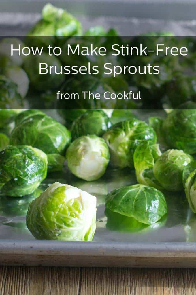 Whole brussels sprouts that have been tossed in oil on a baking sheet. "How to Make Stink-Free Brussels Sprouts from The Cookful" is a banner across the top of the picture.