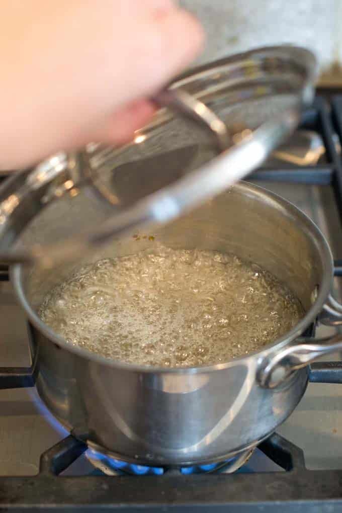 Saucepan with bubbling syrup.