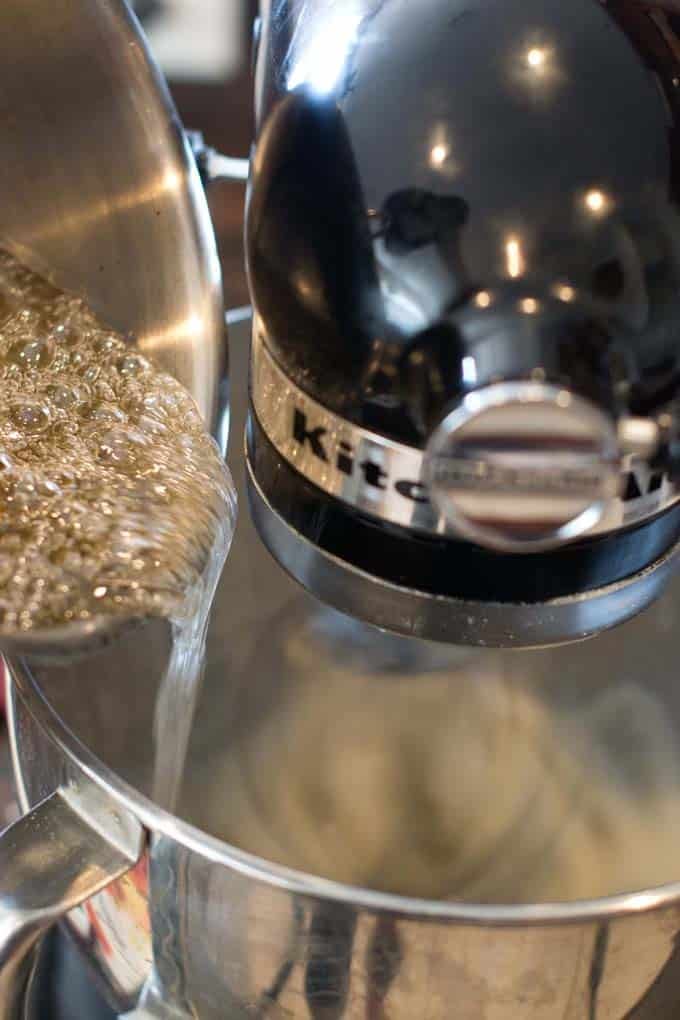 Slowly add sugar syrup to gelatin Slowly add sugar syrup to gelatin in stand mixer.