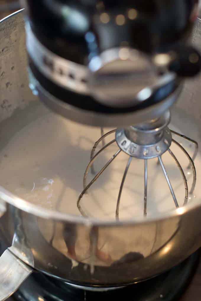Whisking marshmallow mixture in stand mixer.