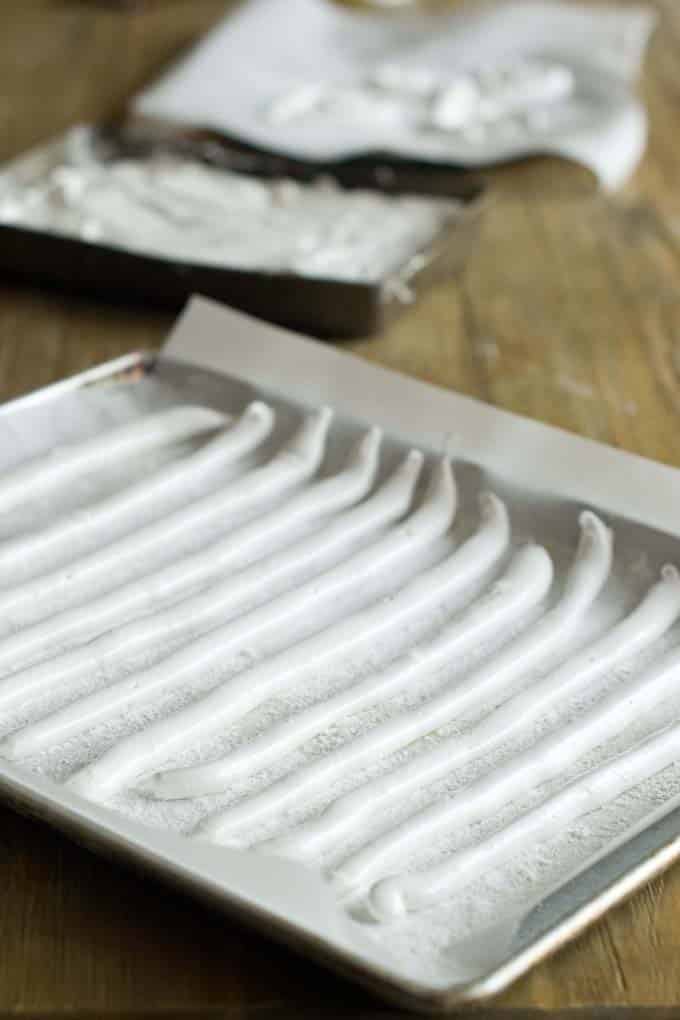 Dusted lines of marshmallow with cornstarch and sugar.