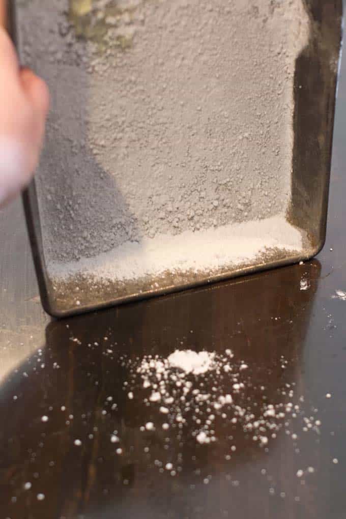 Shake, shake, shake Pan being moved around to completely cover with cornstarch mix.