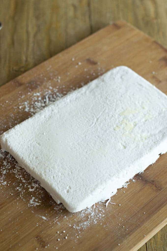 One giant mallow on a cutting board.