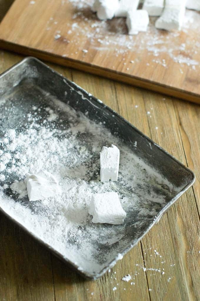 Toss large marshmallows with cornstarch.