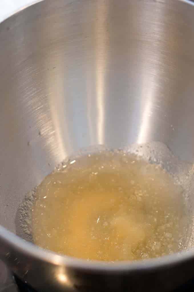 Gelatin blooming in bowl of stand mixer.