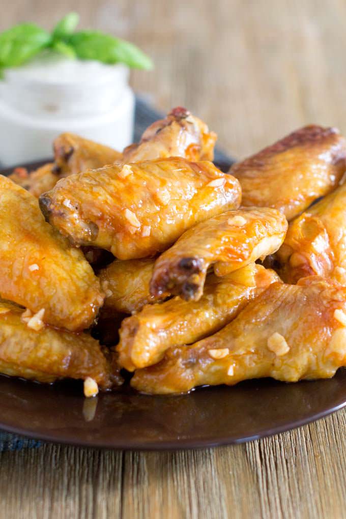 Fancier Buffalo Wings, the wing sauce is made with hot sauce, olive oil, lemon juice and garlic.