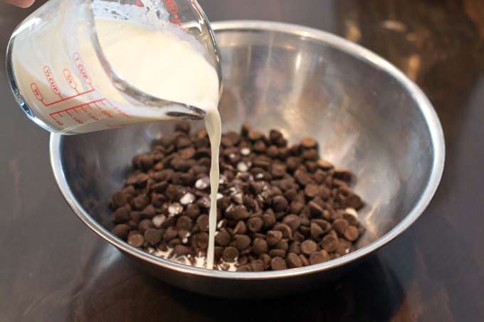 Pour the warm cream over chocolate chips