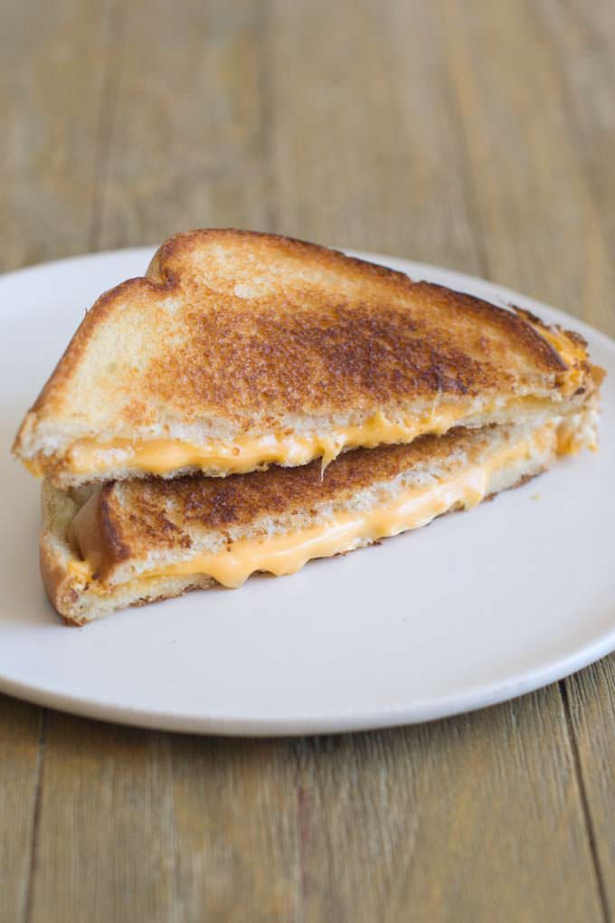 Classic Grilled Cheese on a white plate.