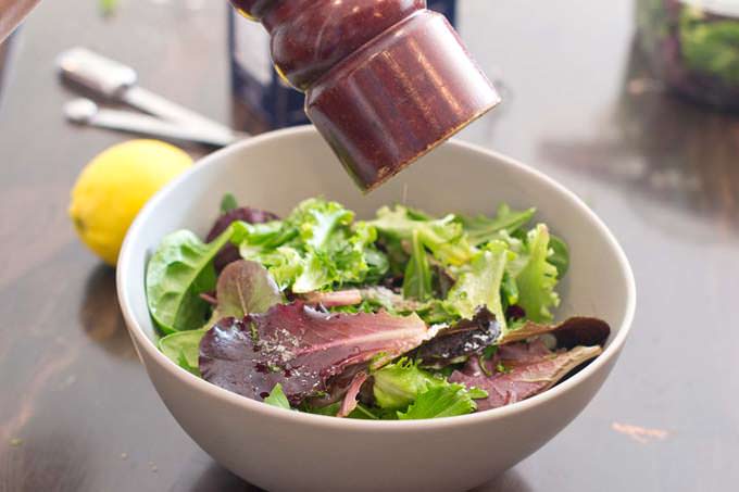Add coarse black pepper to the salad