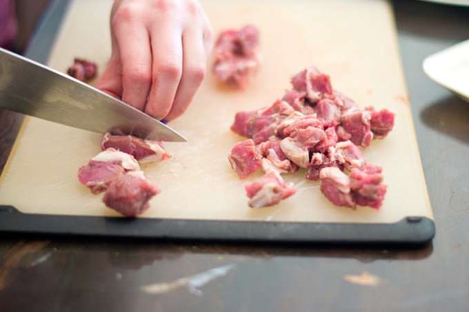 Chopping the meat fine 