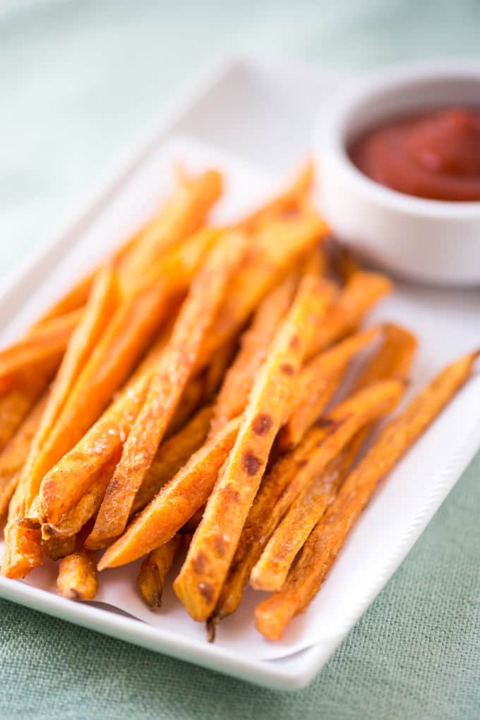 Crispy Sweet Potato Fries on a plate with ketchup dish.