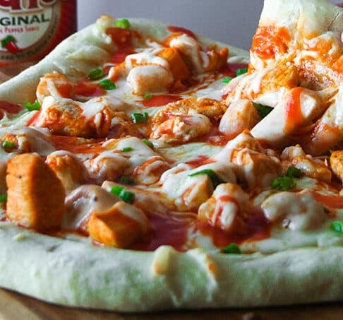 Pizza or wings? Decisions, decisions. Don't pick one. Make pizza with buffalo chicken. Dilemma solved!