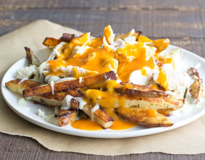 When Buffalo chicken and poutine meet up, you're in for a rich and creamy, spicy, cheesy plate of amazingness. For sure!