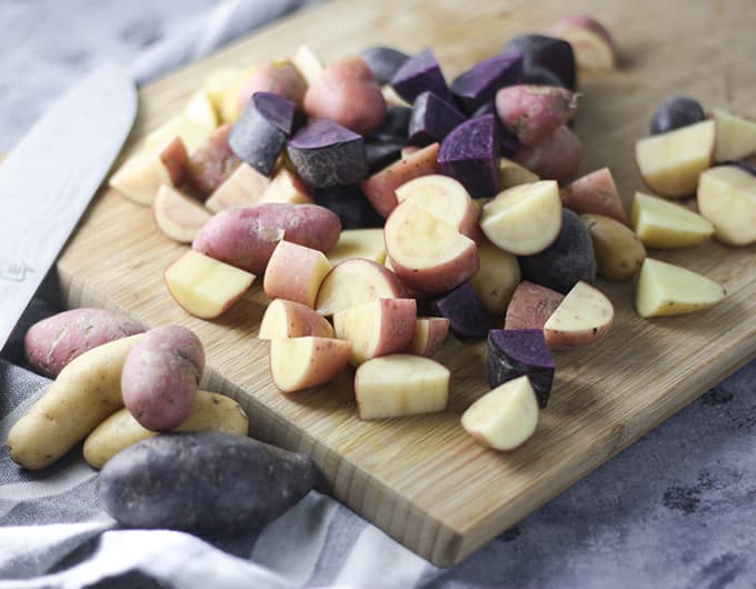 Cubed fingerling potatoes of various colors.