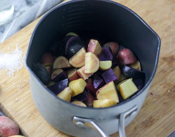 Cubed potatoes in a large pot.