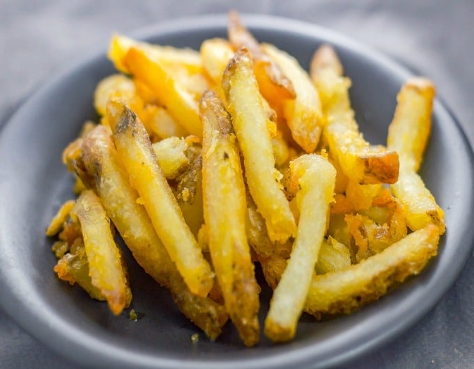 Deep fried french fries on a plate.