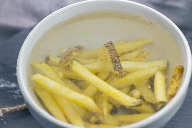 Cut potatoes soaking in water.