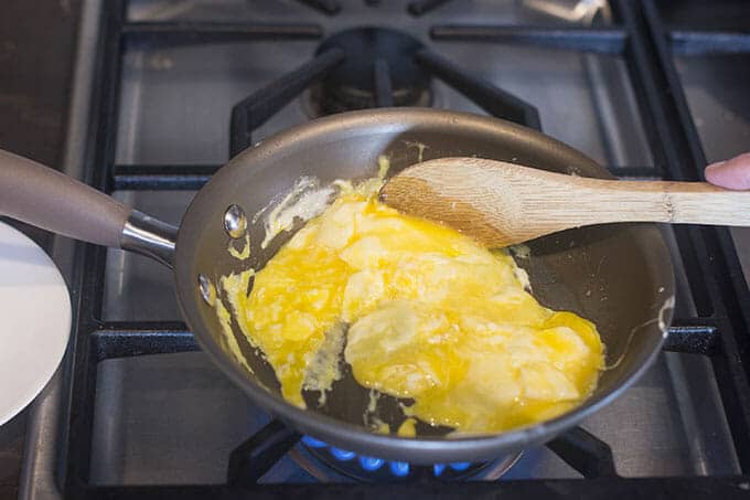 Cooking scrambled eggs.