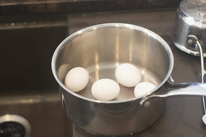 4 eggs in the bottom of a saucepan.