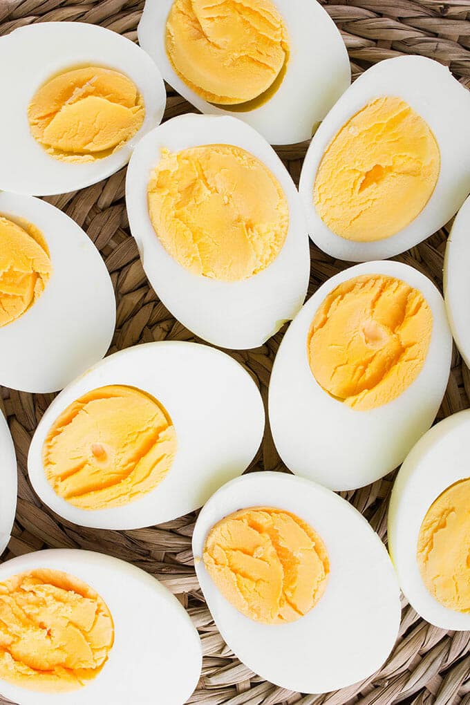 Overhead view of halved hard boiled eggs