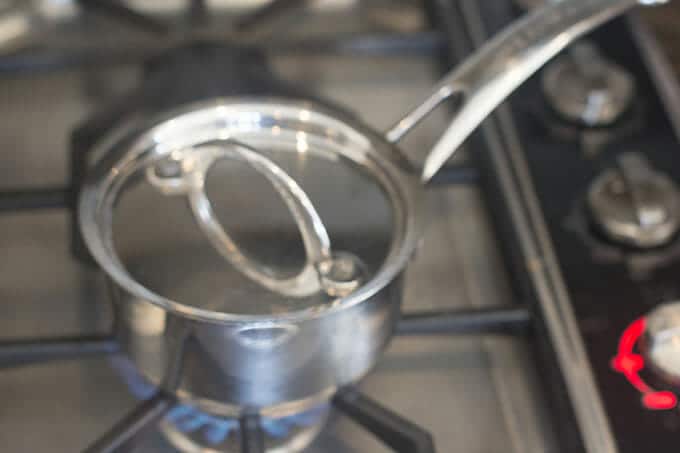 Covered saucepan on a stovetop.