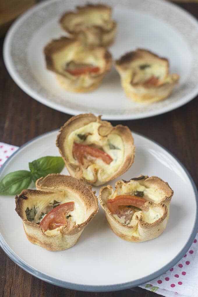 Mini Quiches in Toast Cups on white plates