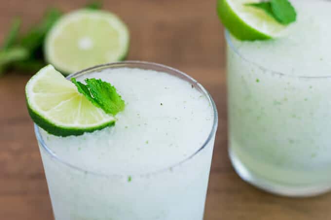 Frozen mojito in glass with lime