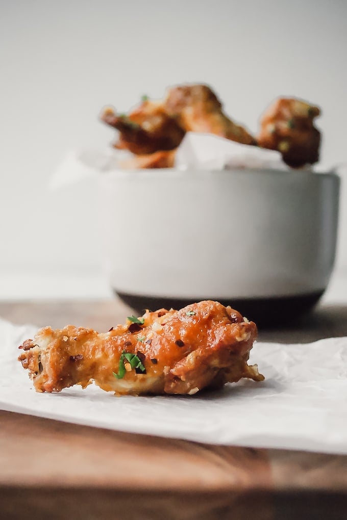 We found the secret to crispy chicken wings and we're sharing it with you in this air fryer Honey Garlic Chicken Wing recipe. They're a good enough excuse to gather friends for a party.