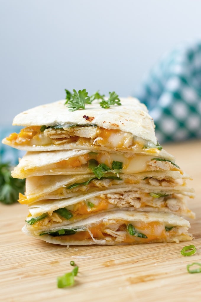 Cheesy chicken quesadilla wedges in a stack.