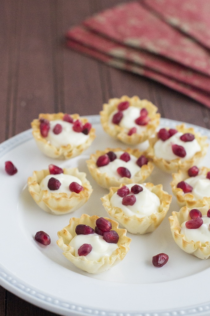 Cheesecake Tarts are my favorite no-bake dessert to make for several reasons. One, they're no-bake (except the fillo shells might need a couple minutes), two, they only have 5 ingredients that mix up in almost no time, and three, everyone loves them.