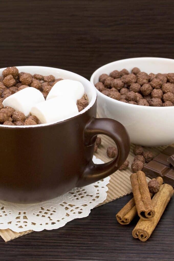 brown mug of hot chocolate with cocoa puff and marshmallows