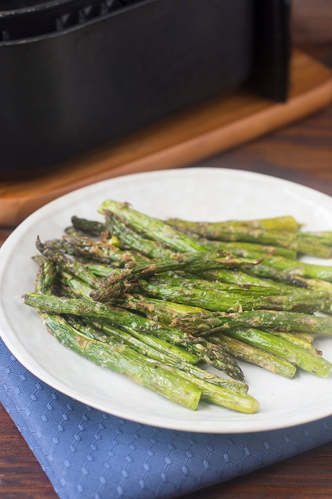 Air Fryer Asparagus on a white plate.