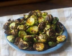 blue plate with crispy brussels sprouts
