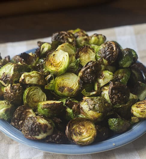 blue plate with crispy brussels sprouts