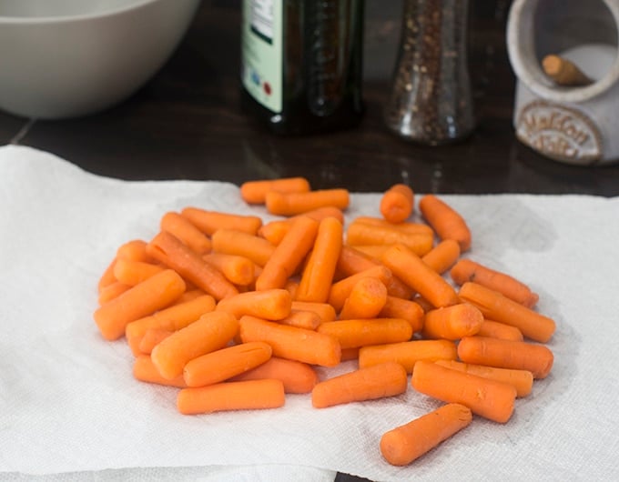 Baby carrots on paper towel.