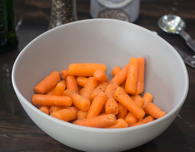 Seasoned carrots in a bowl.