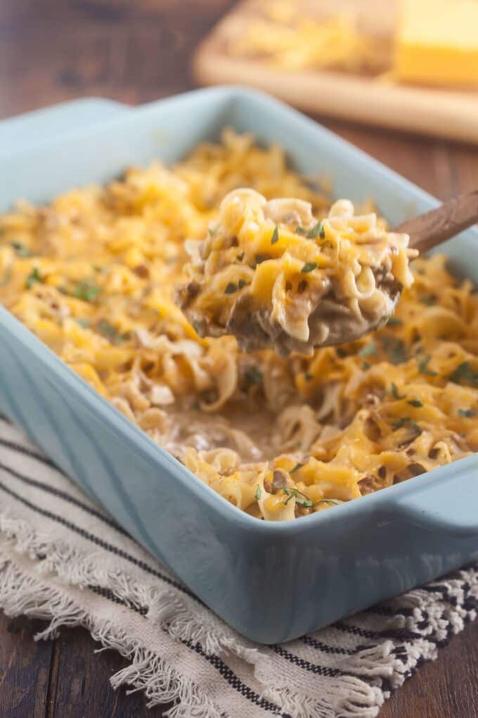 Egg noodles with beef and gravy in a blue casserole dish