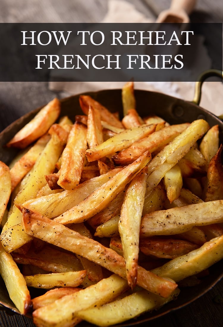 Golden fried french fries in shallow metal pot; the text overlay reads, "How To Reheat French Fries".