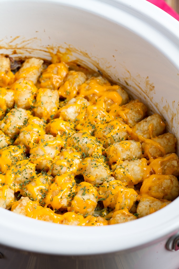 Slow Cooker Tater Tot Casserole uses all the ingredients of a traditional hotdish with the convenience of being able to prep dinner in the morning and have it ready when you want to eat.