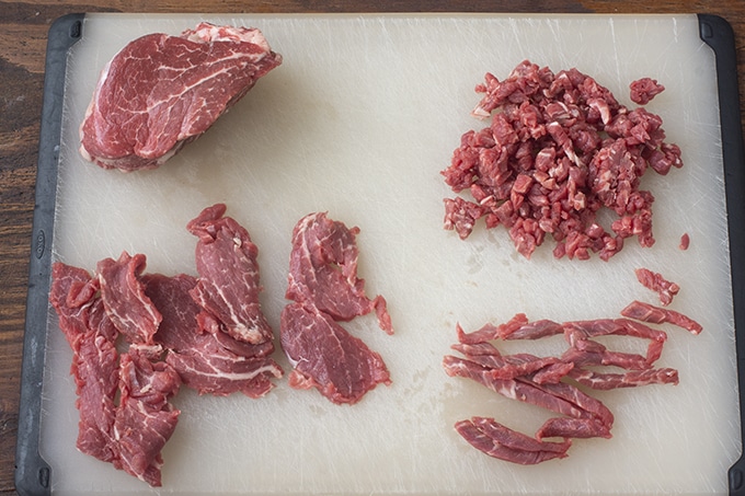Beef in  the different steps of cutting for tartare.