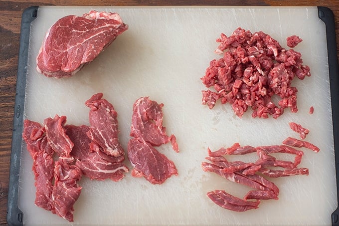 Beef in  the different steps of cutting for tartare.