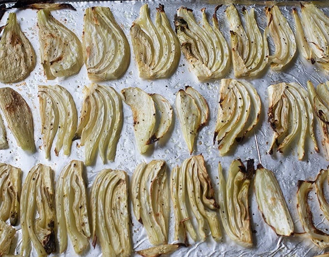 Roasted fennel on a baking sheet.