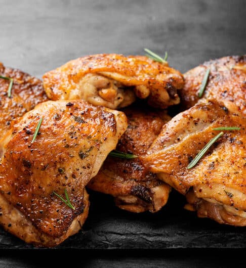 Grilled chicken thighs with spices and lemon.