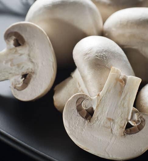 white mushrooms cut and whole