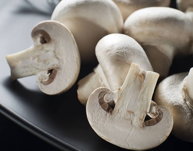 white mushrooms cut and whole