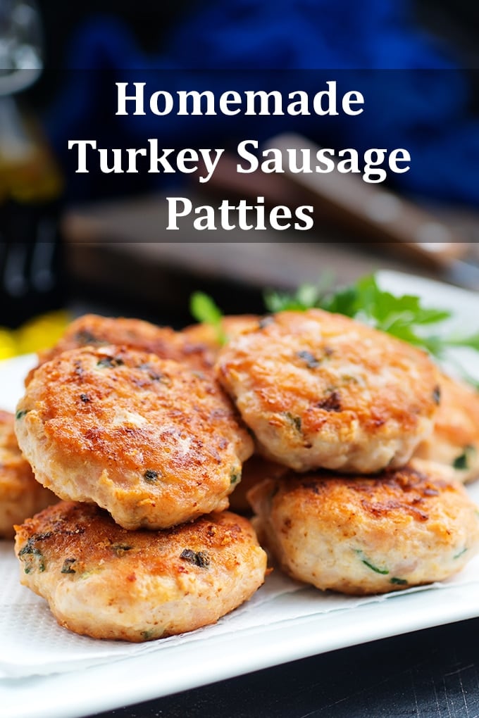 Turkey breakfast sausage patties in a pile on a white plate. The words "Homemade Turkey Sausage Patties" are on the image.