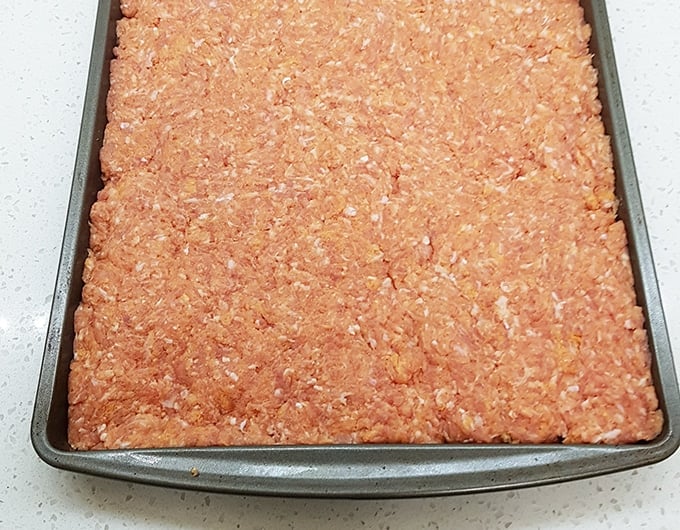 Baking sheet of ground pork.