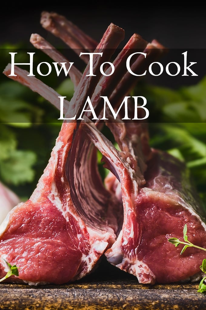 lamb chops with fresh herbs in the background